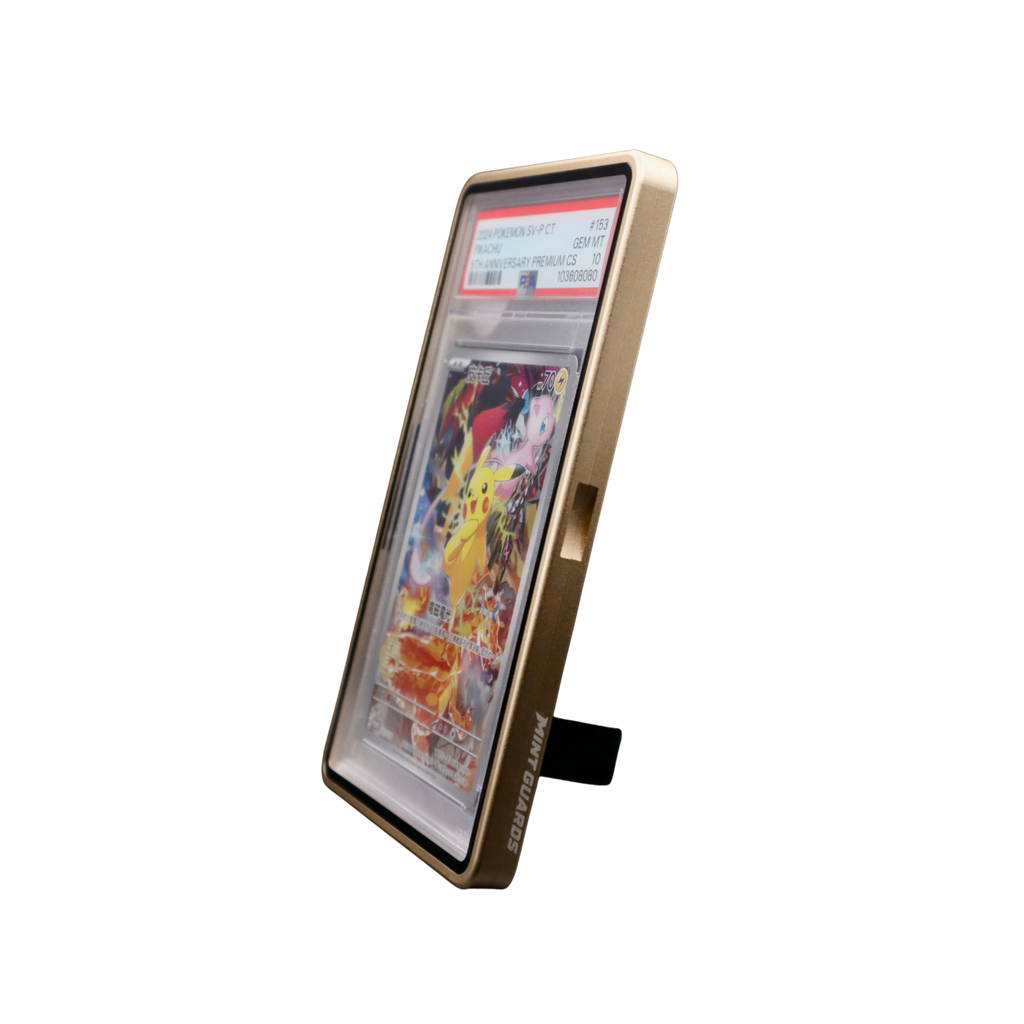 A gold protective standing display graded card guard for a graded trading pokemon onepiece sports cards and slabs, with an in-built kick stand 